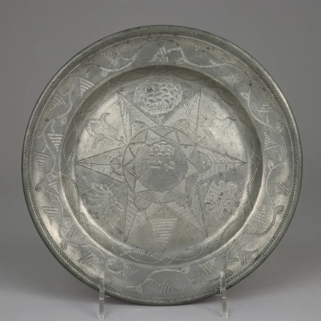 An engraved metal plate, representing personalised made-to-order products