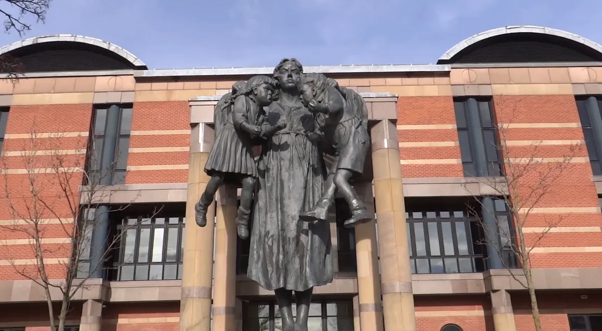 A scales-of-justice statue, representing the build-versus-buy decision